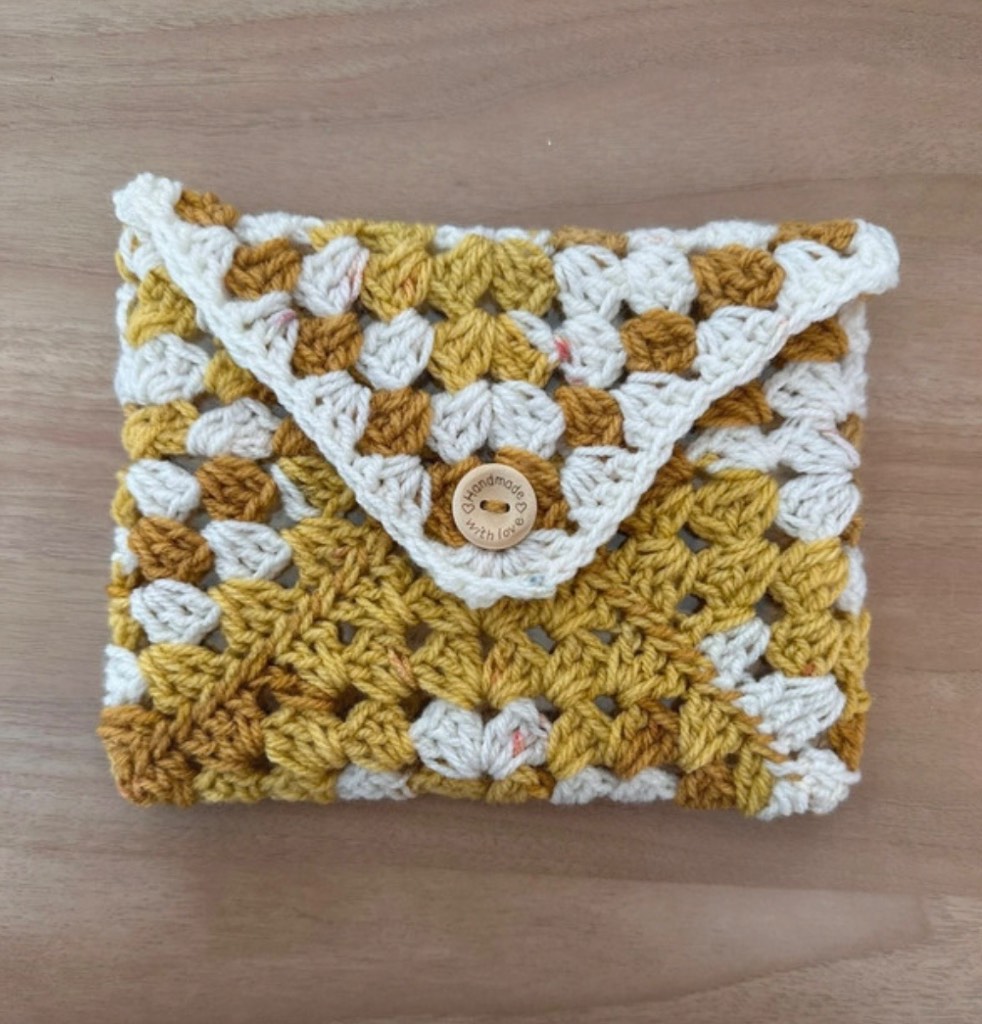 Handmade crochet kindle/ e-reader sleeve with button fastening