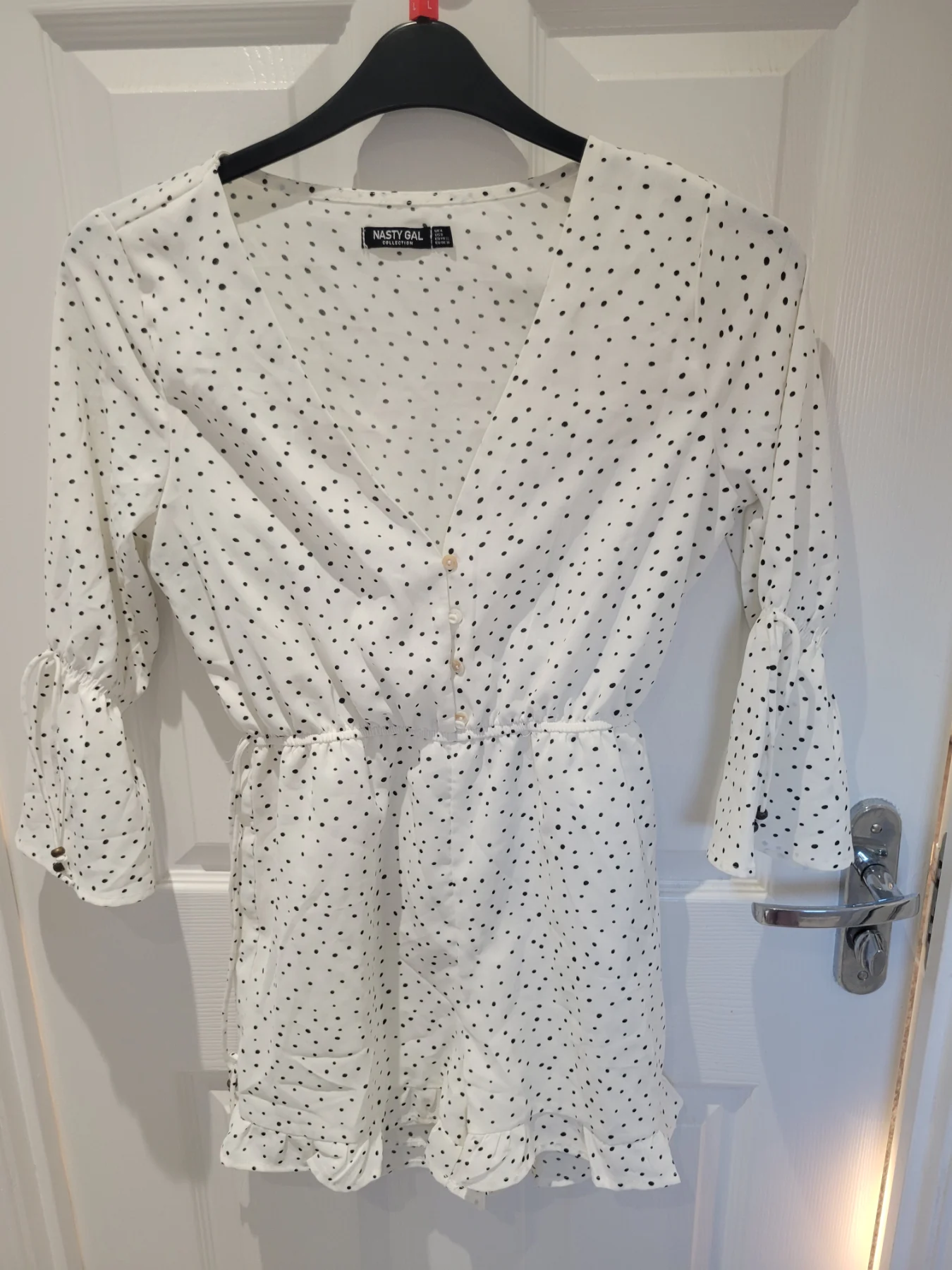 Stay stylish in this Size 4 NastyGal short playsuit, perfect for casual occasions during the summer