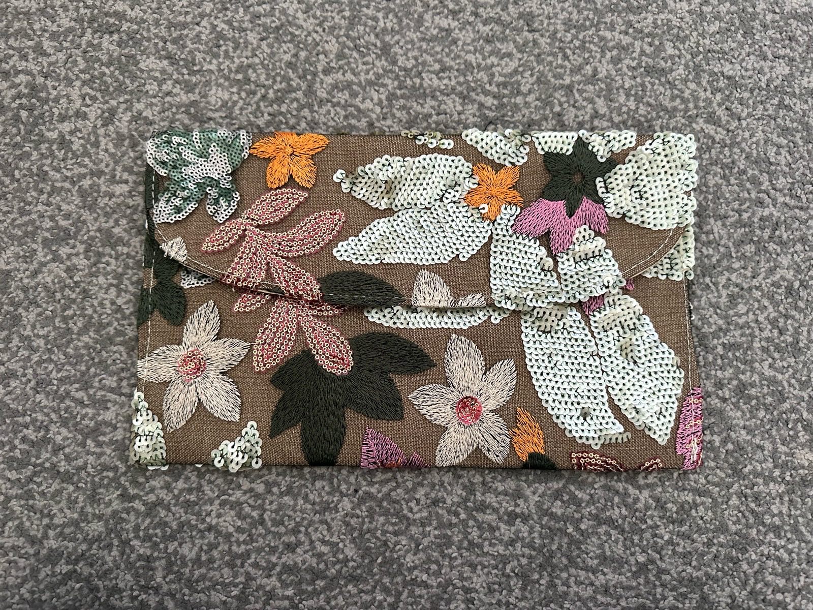 New multi coloured flower clutch bag