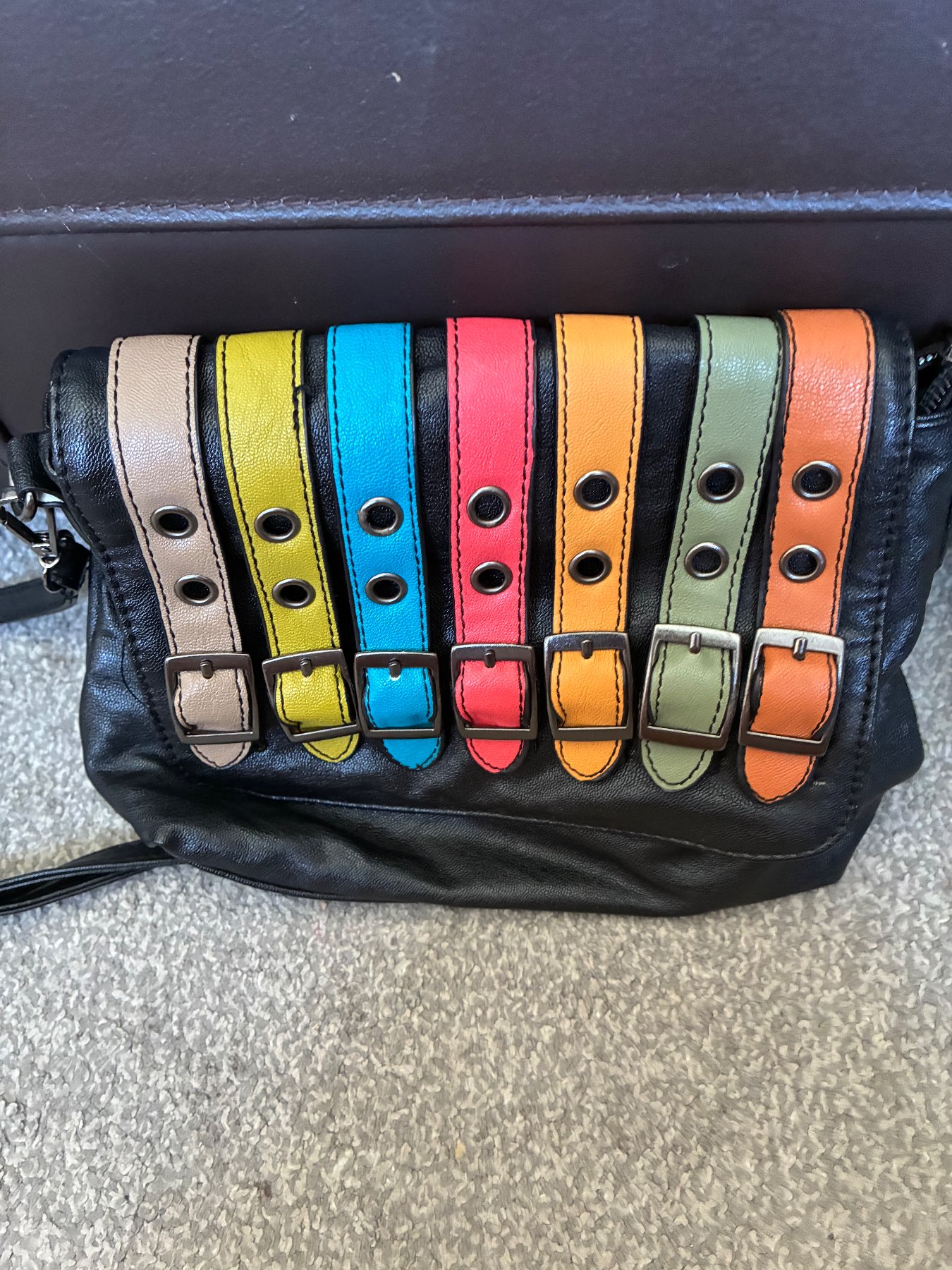 Faye London - black bag with quirky belt design on front