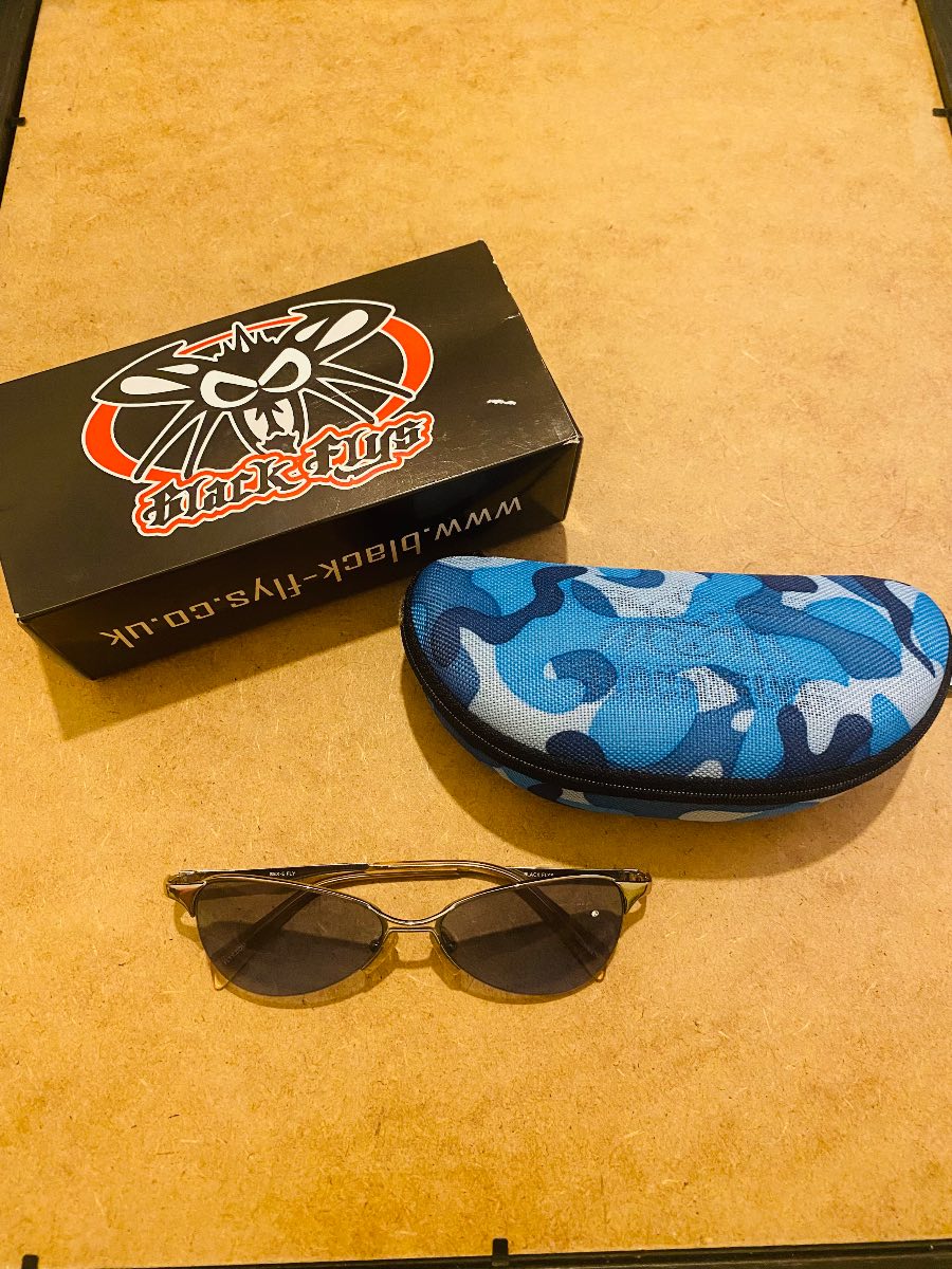 Black flys blue sunglasses