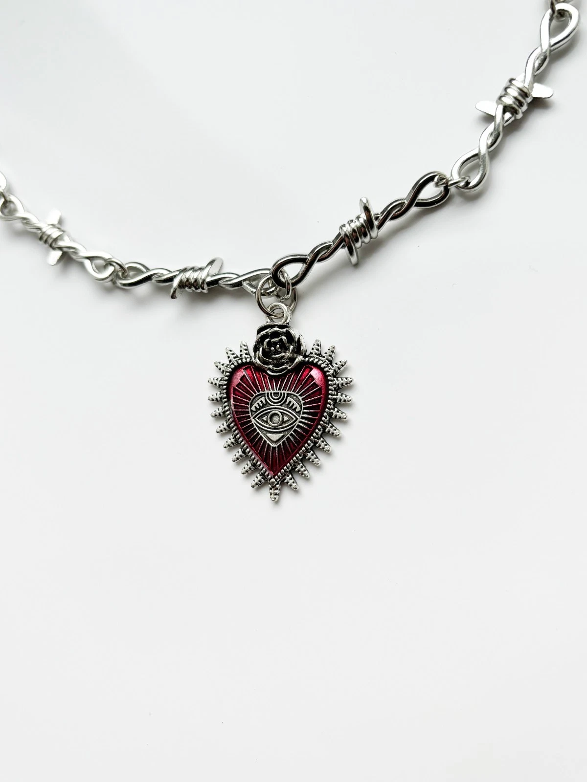 Barbed Wire Necklace with Razor Pendent.  Necklaces is 16 inches in length with a 2 inch extender on