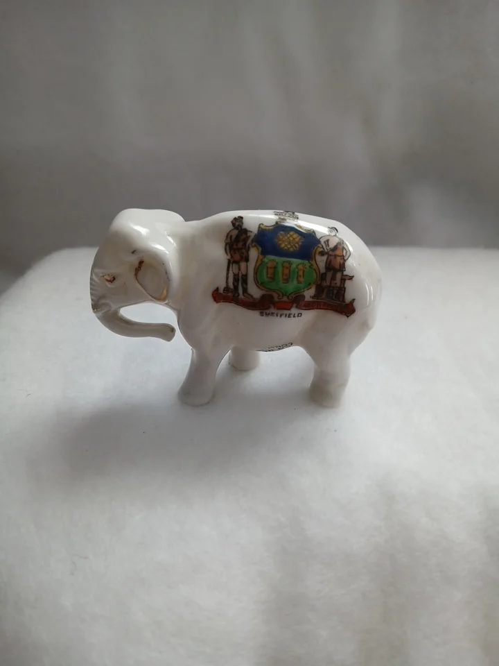 Small Porcelain elephant with Sheffield coat of arms.