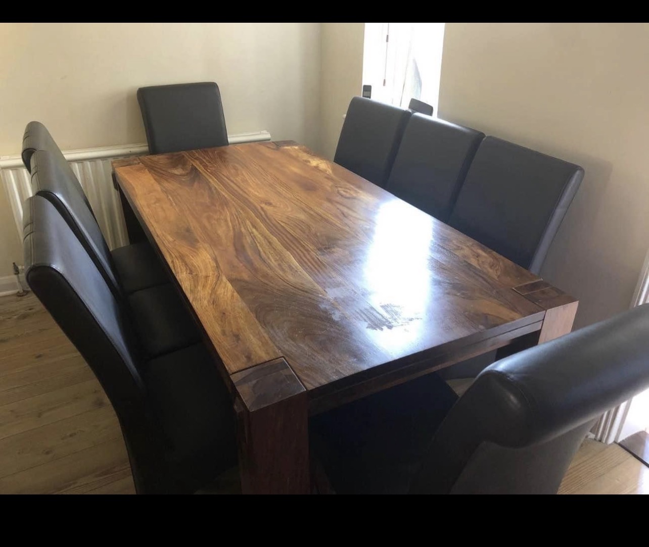 Beautiful solid mahogany chunky dining table and 8 faux leather dining chairs.