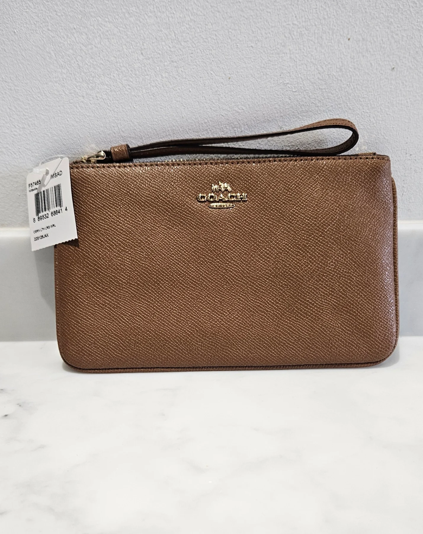 Coach tan/brown wristlet