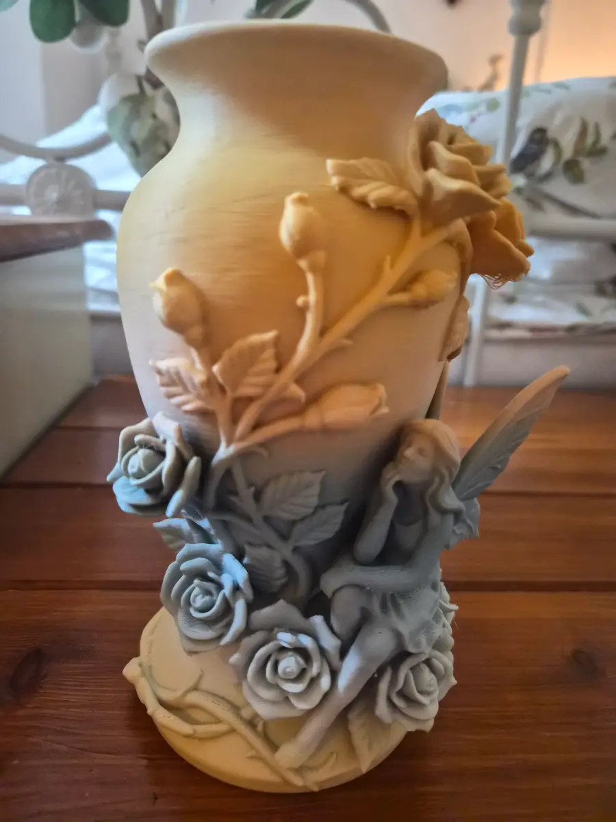 fairy and flower vase