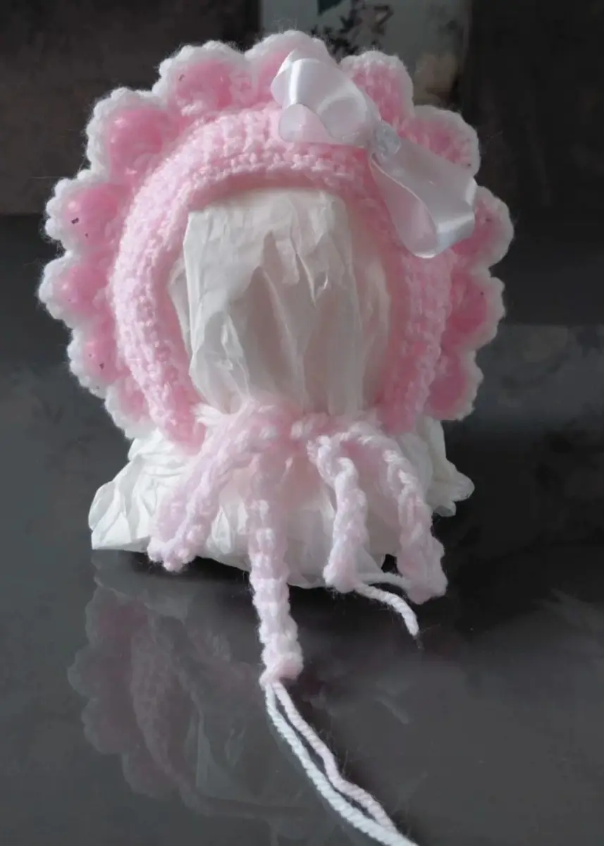 Handmade baby girls pink edged with white bonnet made by