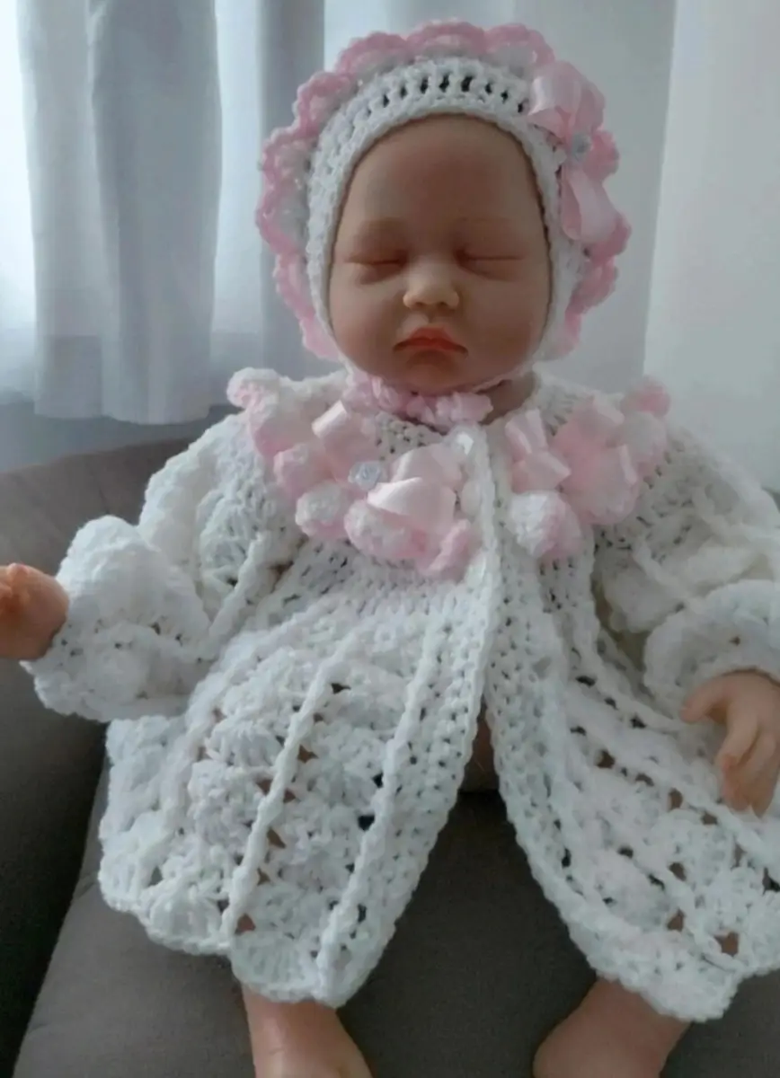 Handmade baby girls cardigan and bonnet matching set.
