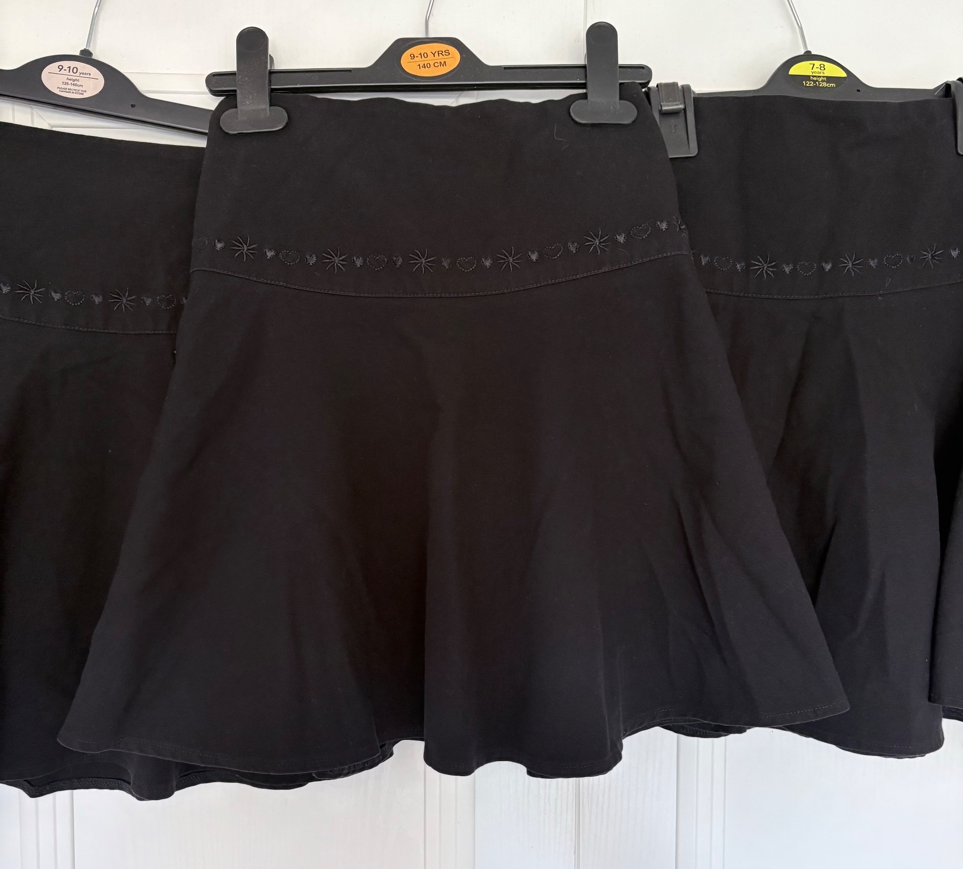 Girls black school skirts - age 9 years