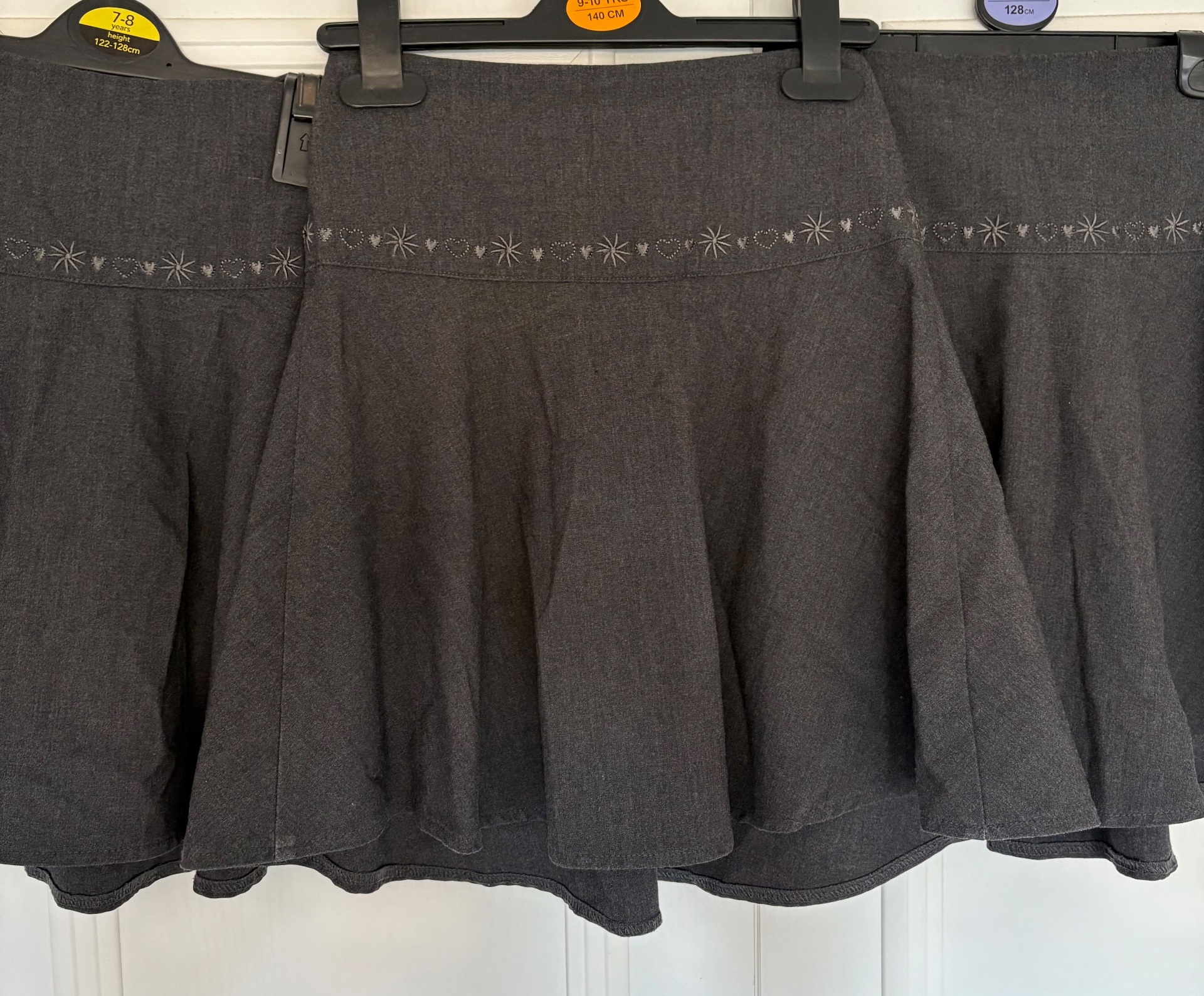 Girls grey school skirts - age 8 years
