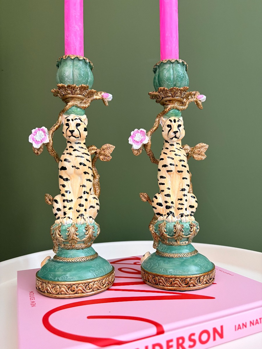 Pair of ornate leopard cheetah candlestick holders