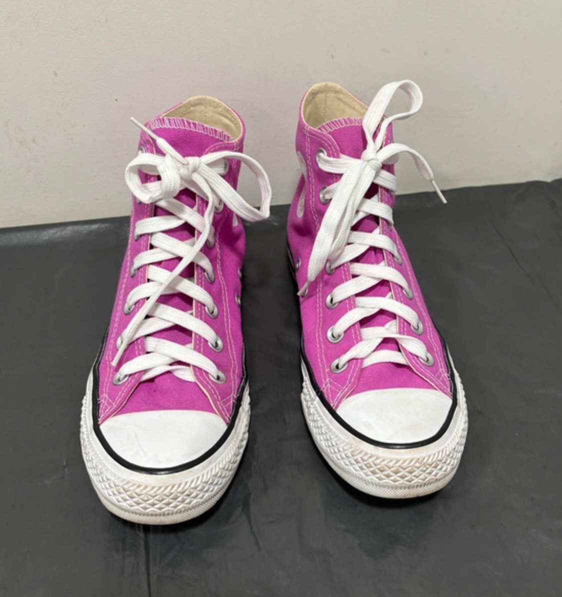 Women’s pink high top converse