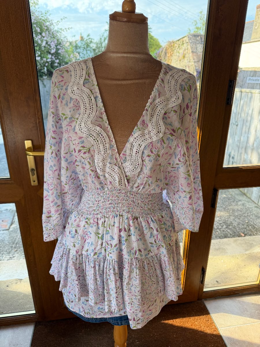 River Island floral playsuit size small
