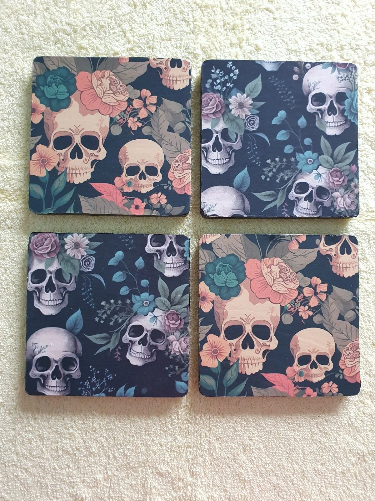 New and Unused, Set of 4 handcrafted wooden coasters  with skull design.