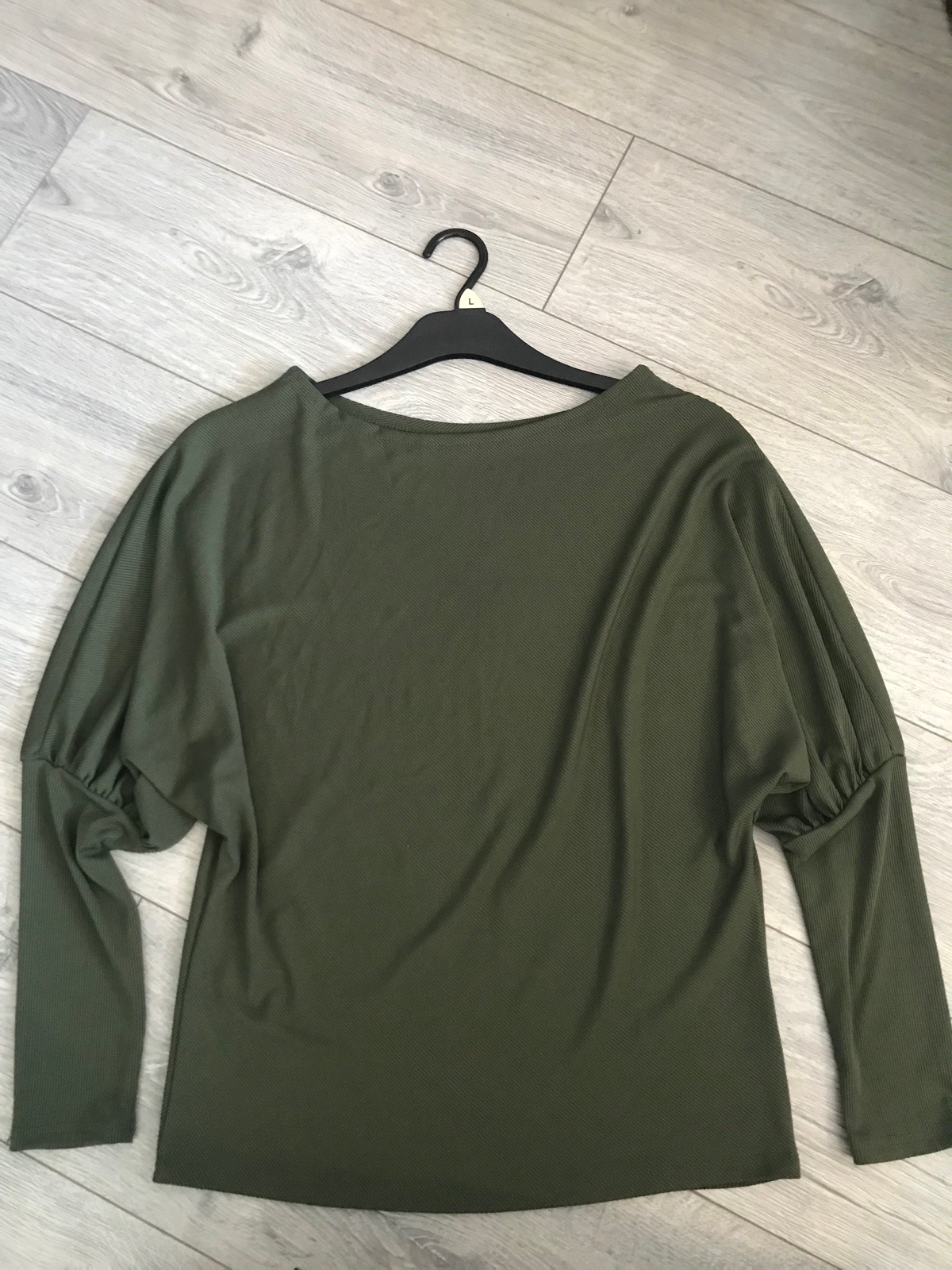 Womens dark green long sleeve top with ruffle sleeves