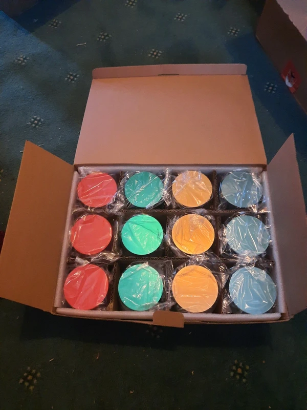 Box of 24 coloured tins for candles, sweets, jewellery etc