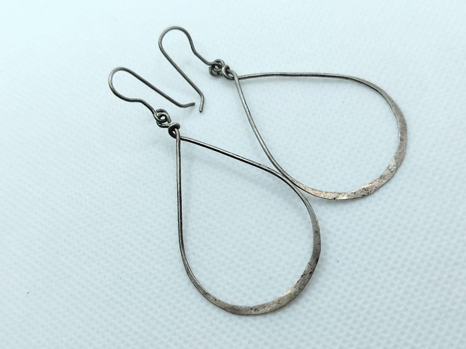 Modernist style hammered effect silver tone white metal hook drop earrings