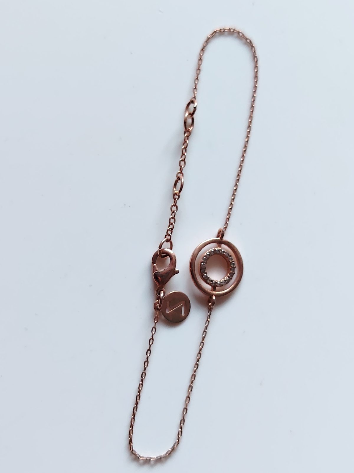 Rose gold tone pave set disc bracelet z by accessorize