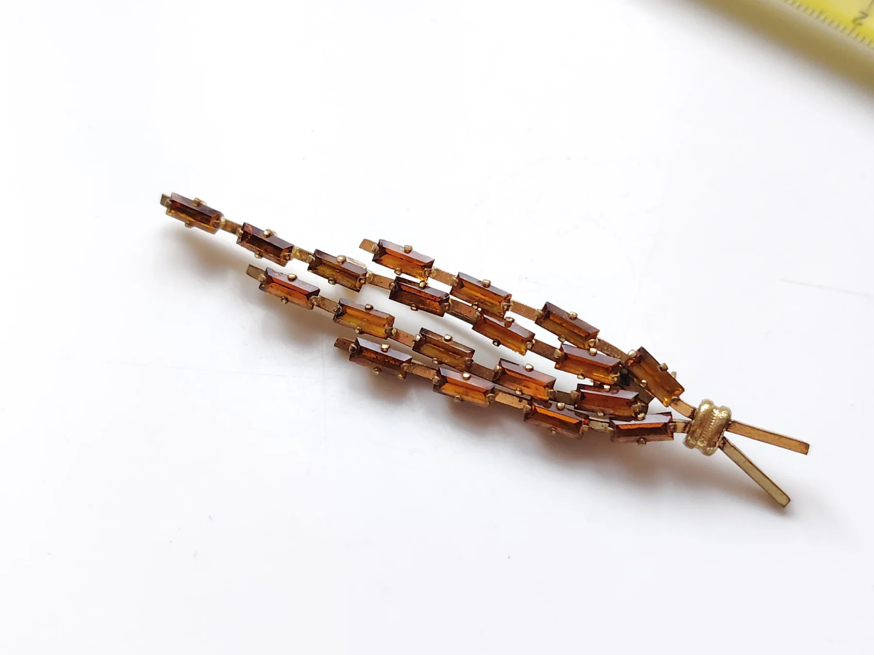 Vintage gold tone baguette rhinestone brooch spray design