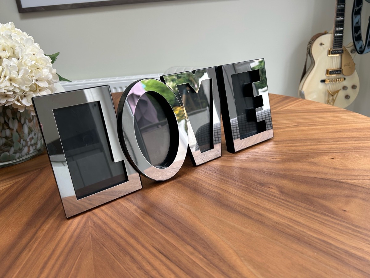 Photo frame.  LOVE.  Fits four photos.