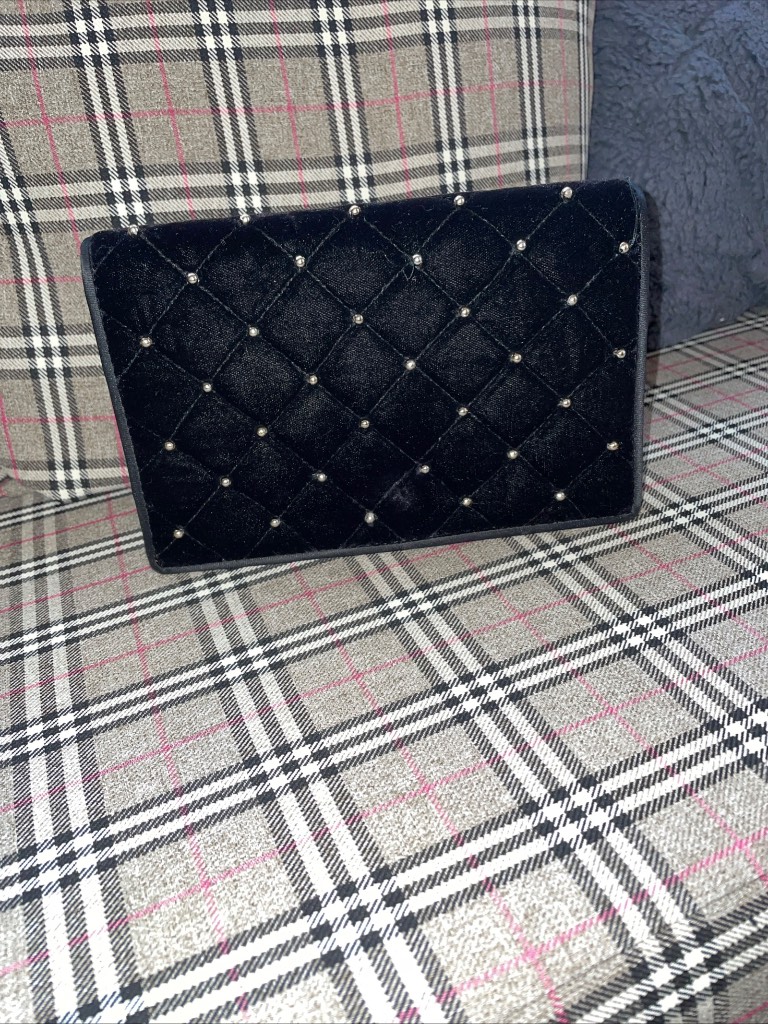 Black clutch bag with gold studs
