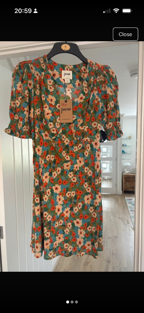 A lovely Joanie clothing Nova Wildflower Print Puff Sleeve Mini Dress in a size 10