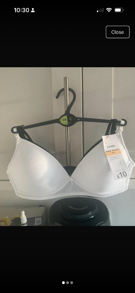 A set of two lightly padded non wire bras, one black one white in a 34C