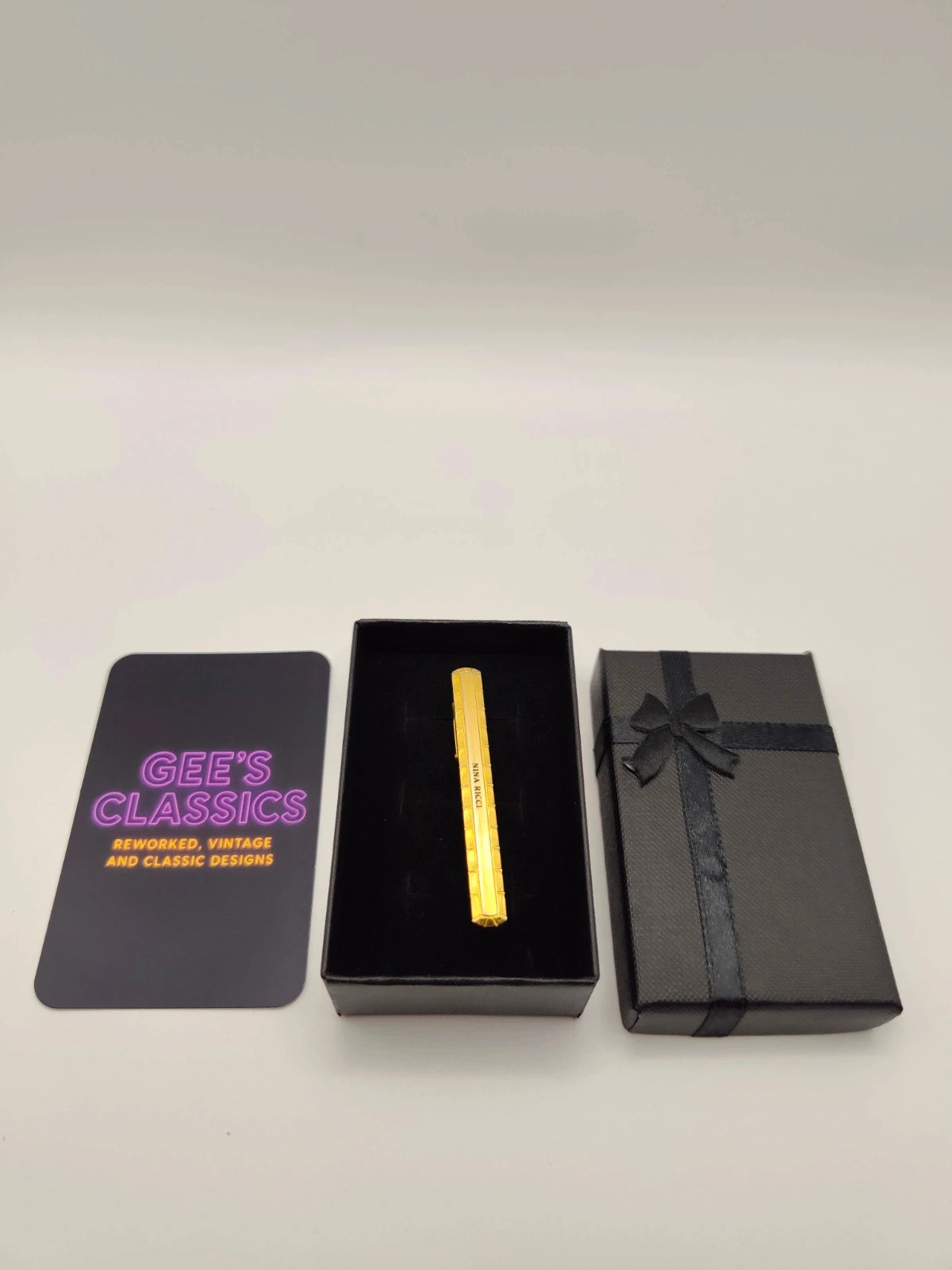Nina Ricci gold tone vintage tie clip