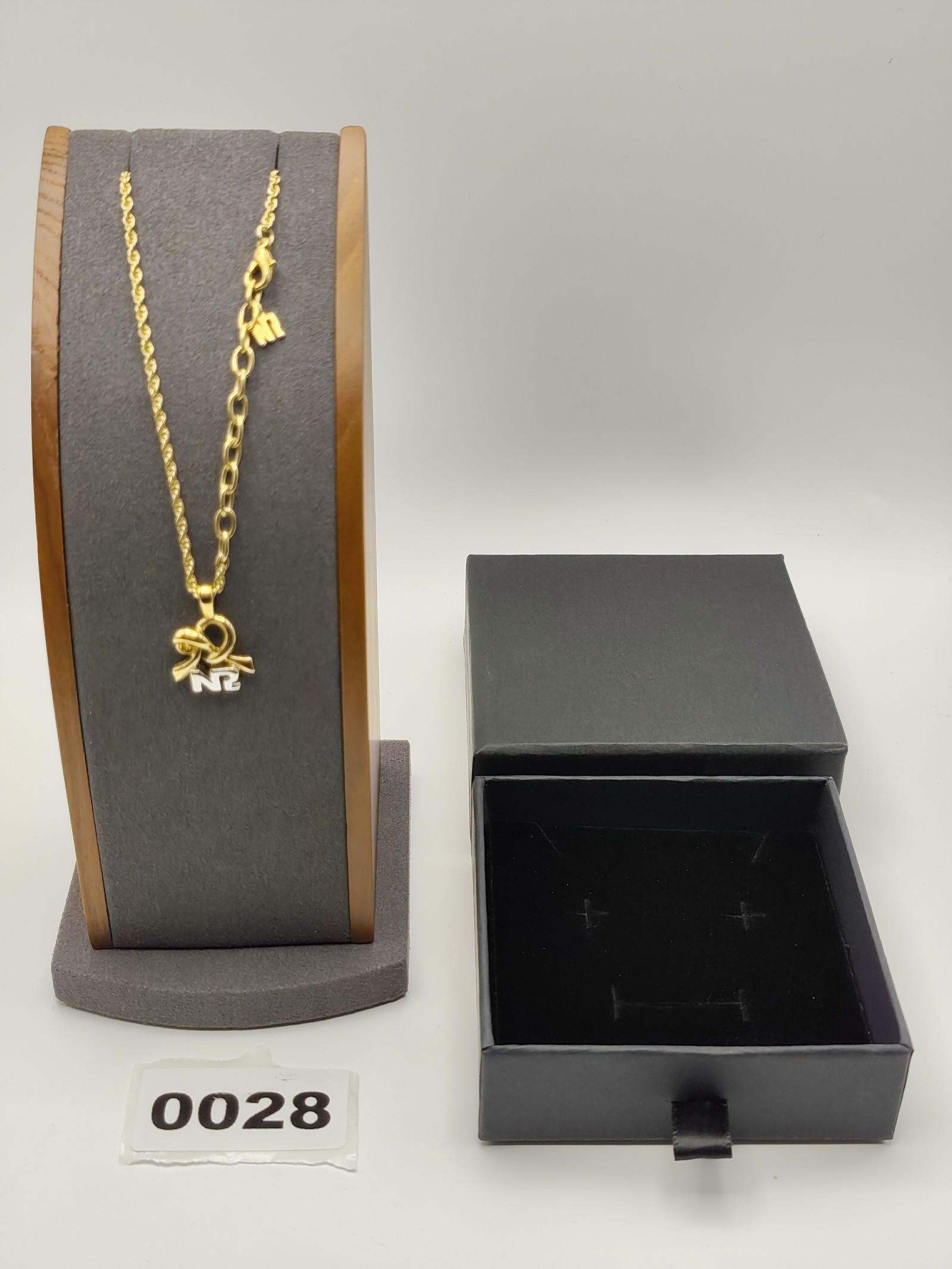 Nina Ricci Gold Tone Ribbon Pendant Necklace with Box