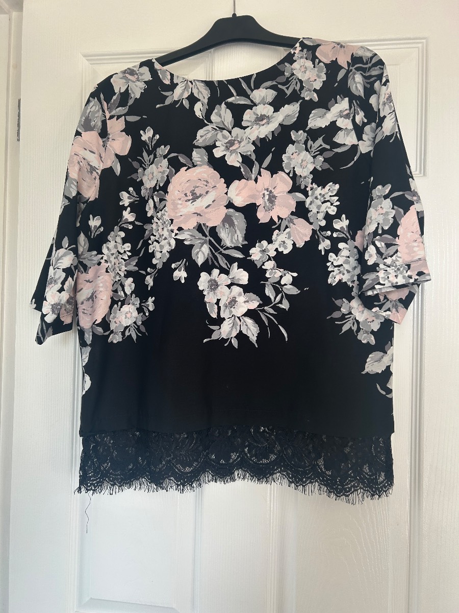 Black blouse with pink flowers