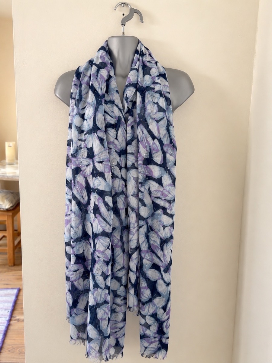 Beautiful lightweight oversized scarf featuring an elegant blue, lilac and white leaf print on a nav