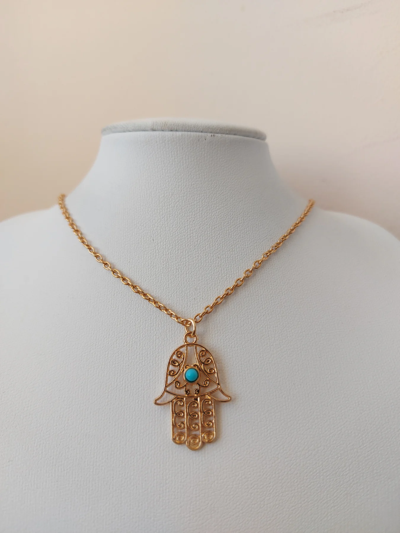 Gold colour palm pendant necklace