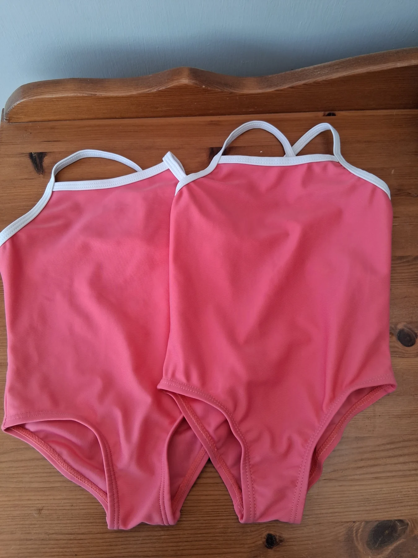 2 brand new girls swimming costumes sizes 6-9/9-12 months