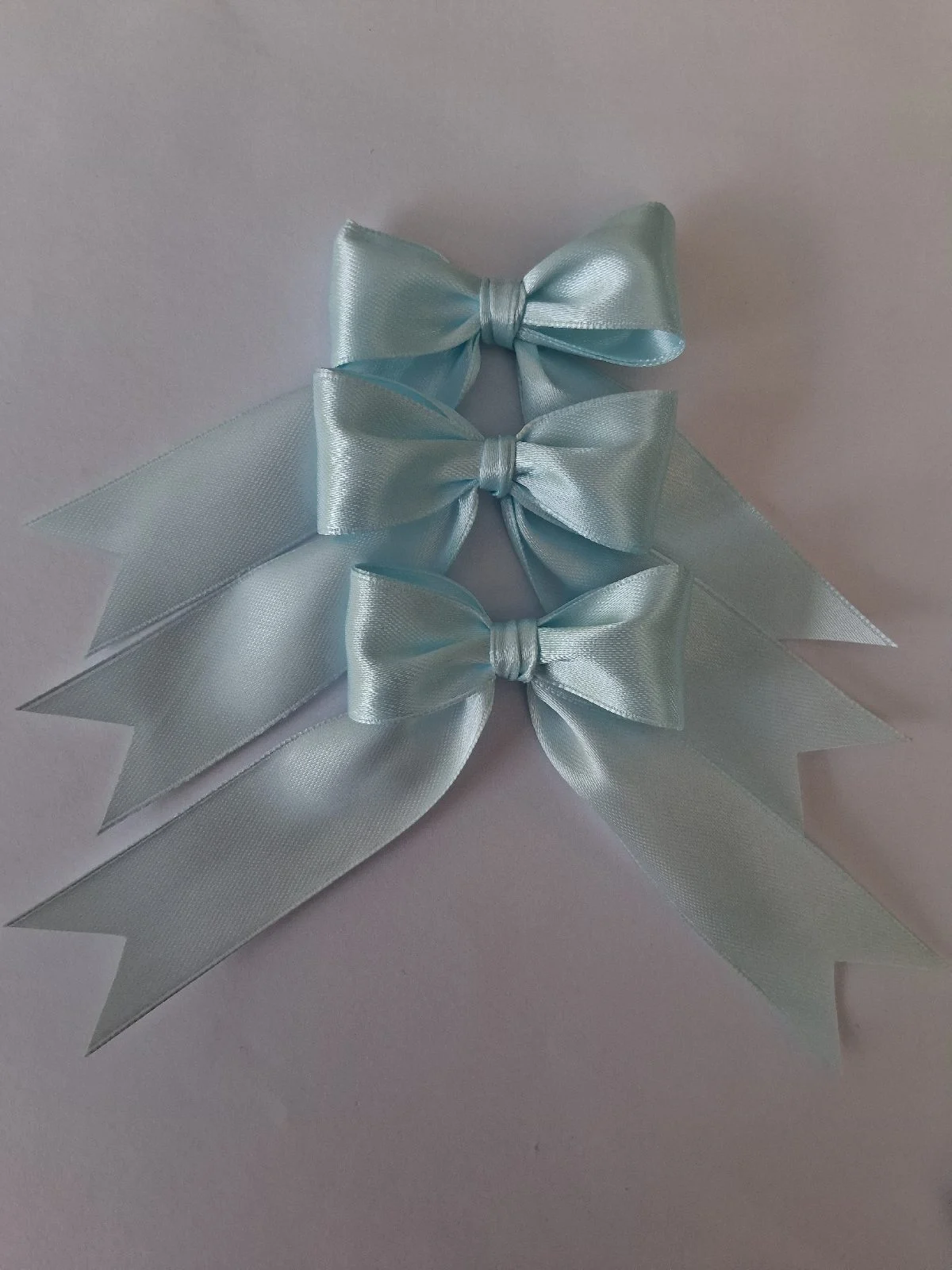 12 light blue satin bows