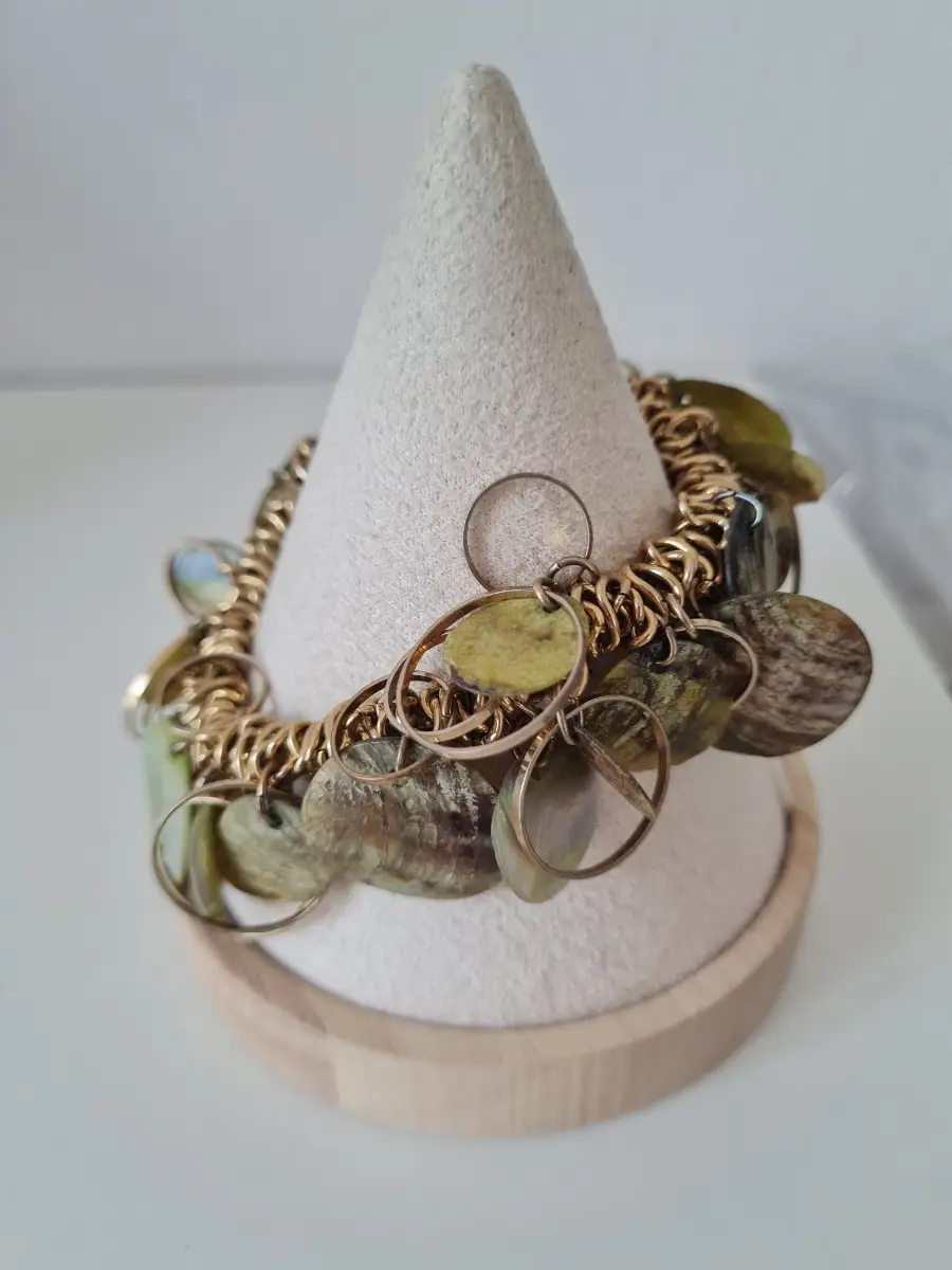 Gold tone green shell bracelet