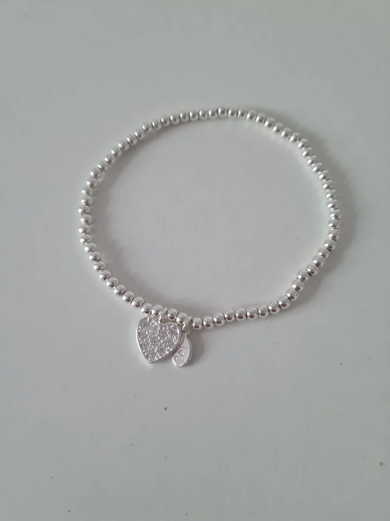J J Joma Silver tone rhinestone heart  bracelet