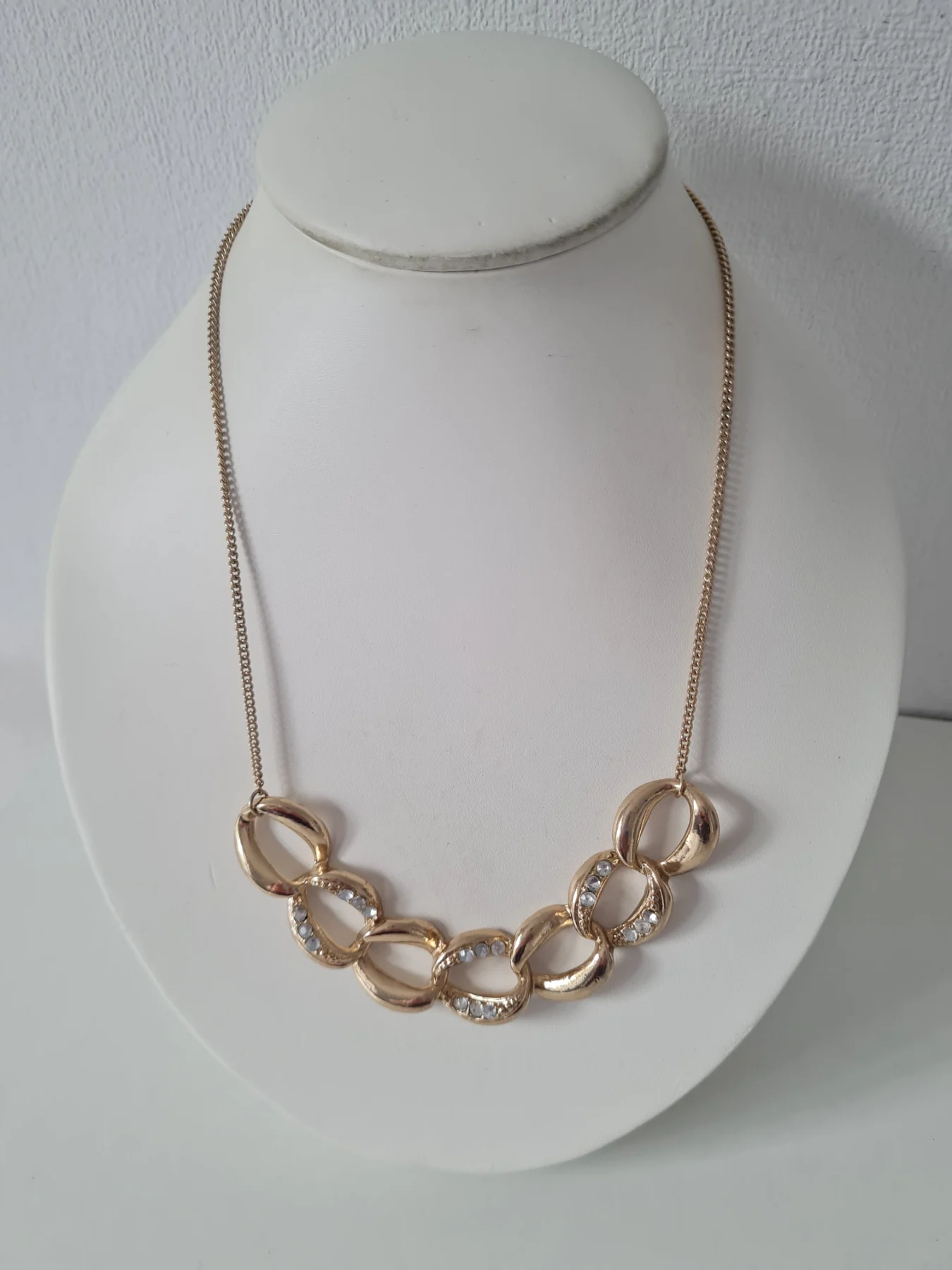 Gold tone rhinestone infinity collar necklace