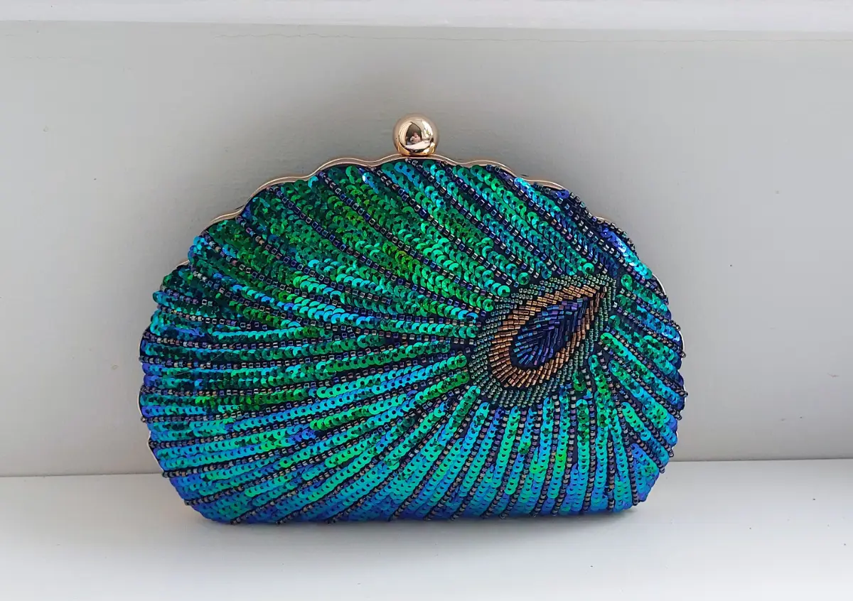 Sequin peacock clutch bag.