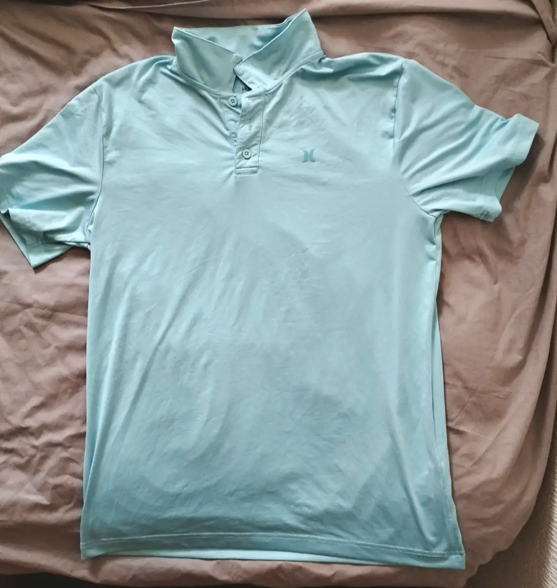 Light blue Hurley polo shirt. Size: 18/20 (Youth XL) Good Condition