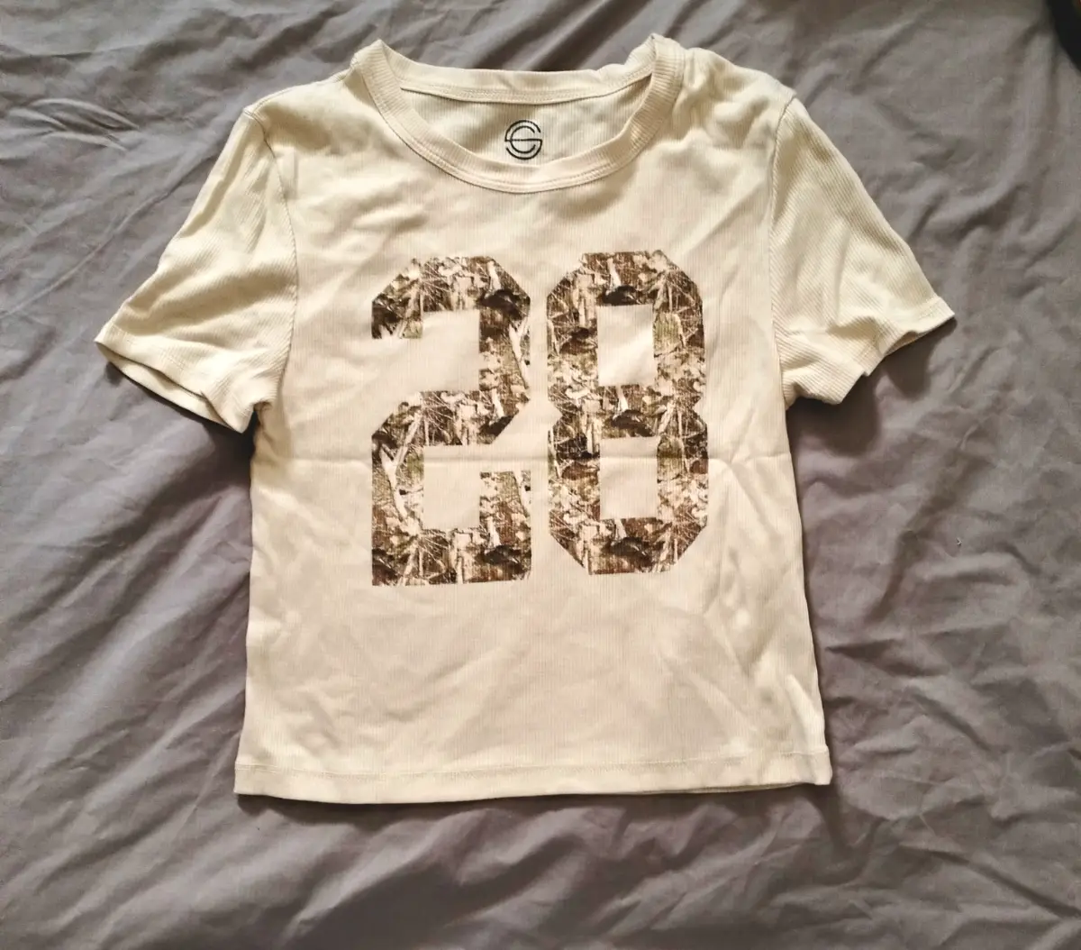 Social Culture cream camo number 28 cotton & polyester baby tee. Large