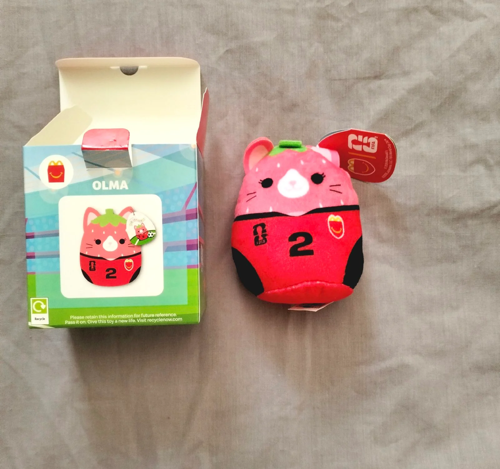 Squishmallows Olma FIFA World Cup 2026 plush strawberry toy in red and black