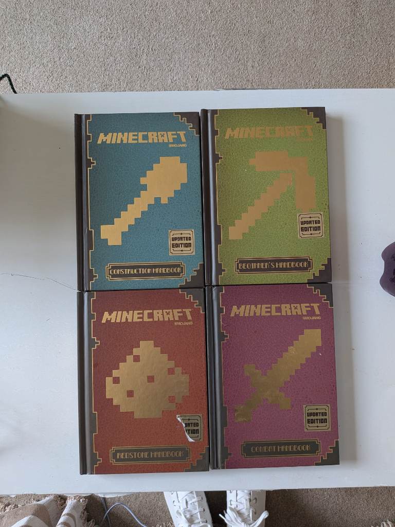 set of 4 official mojang beginners guide to Minecraft