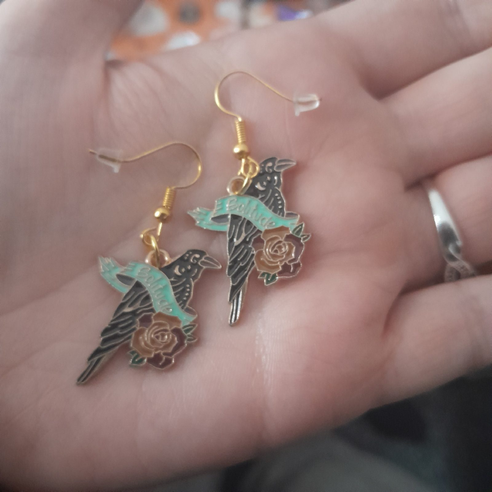 Gold hook raven with rose and baner earrings