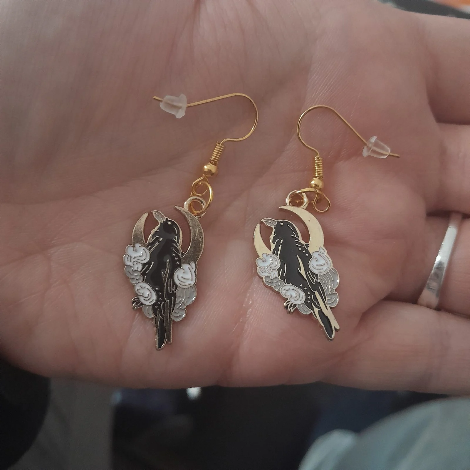Gold hook raven with white rose earrings