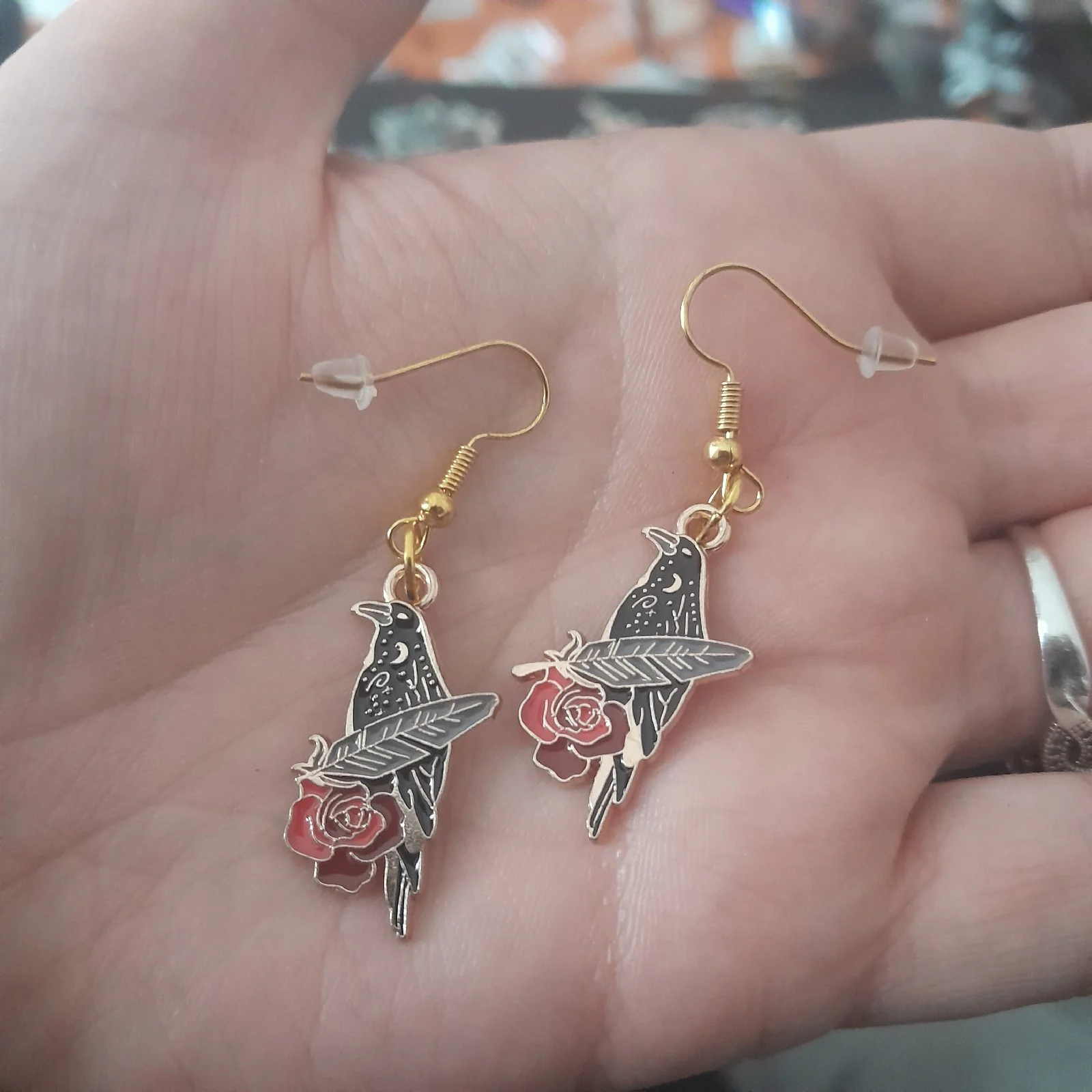 Gold hook raven with feather earrings