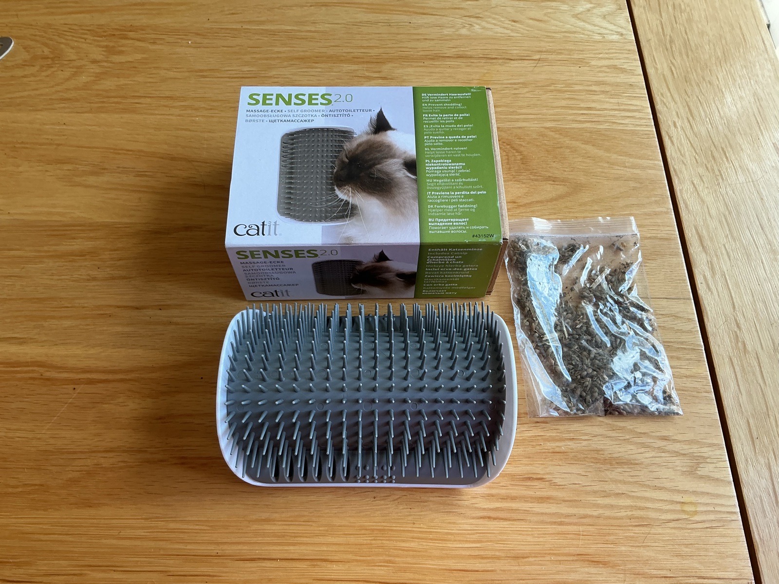 Cat self-groomer. Just attach to corner of sofa/wall / armchair with sticky pads provided.