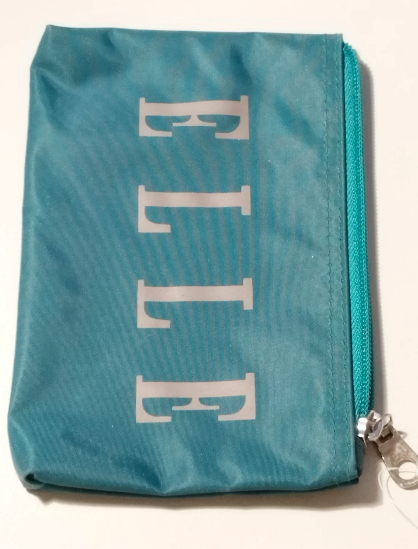Green Elle makeup or toiletries bag