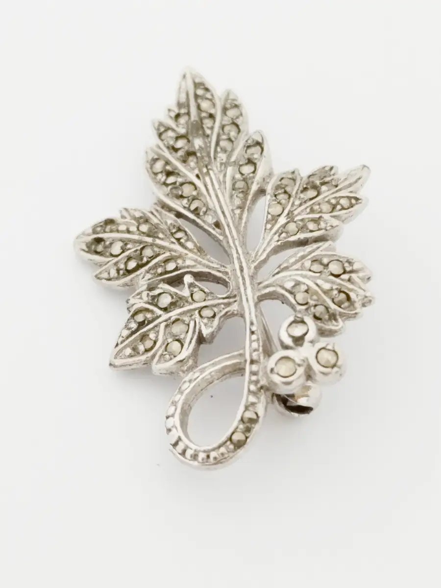 Silver tone leaf brooch with marcasite gems