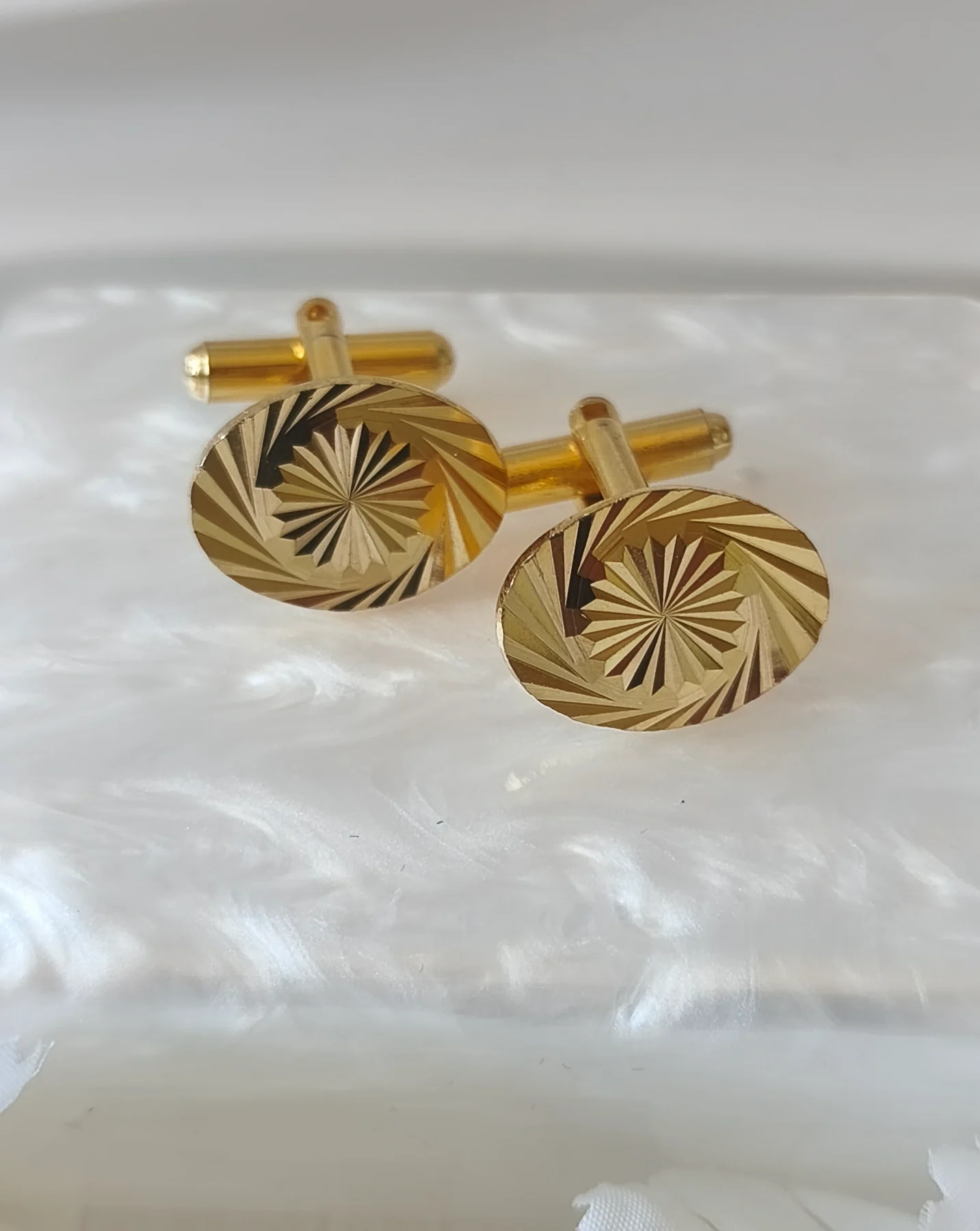 Gold tone diamond cut sunburst cufflinks