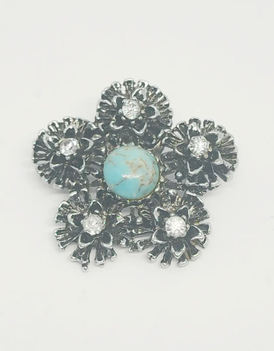 Silver tone flower brooch with turquoise & clear gems
